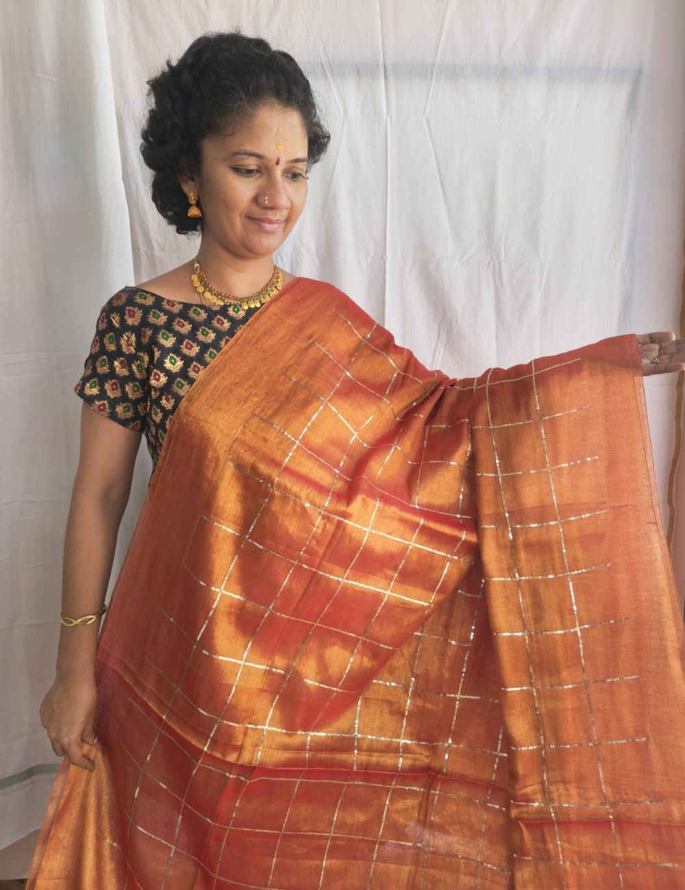 Mulmul Sequence Orange tissue Saree With beautiful tussels