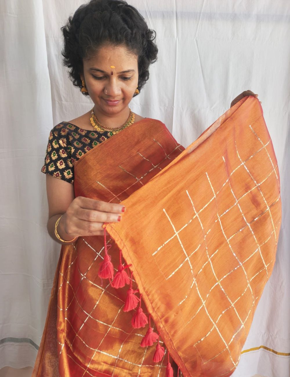 Mulmul Sequence Orange tissue Saree With beautiful tussels