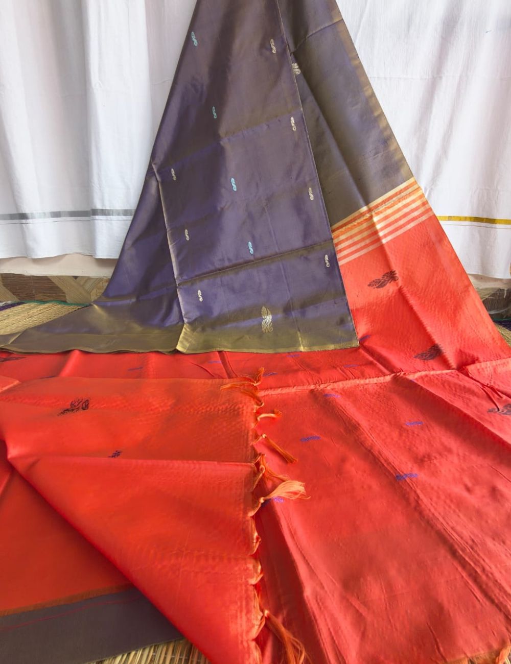 Vaazhai Naar Pattu Saree with Grey and bright orange combination with fancy traditional border and tussels