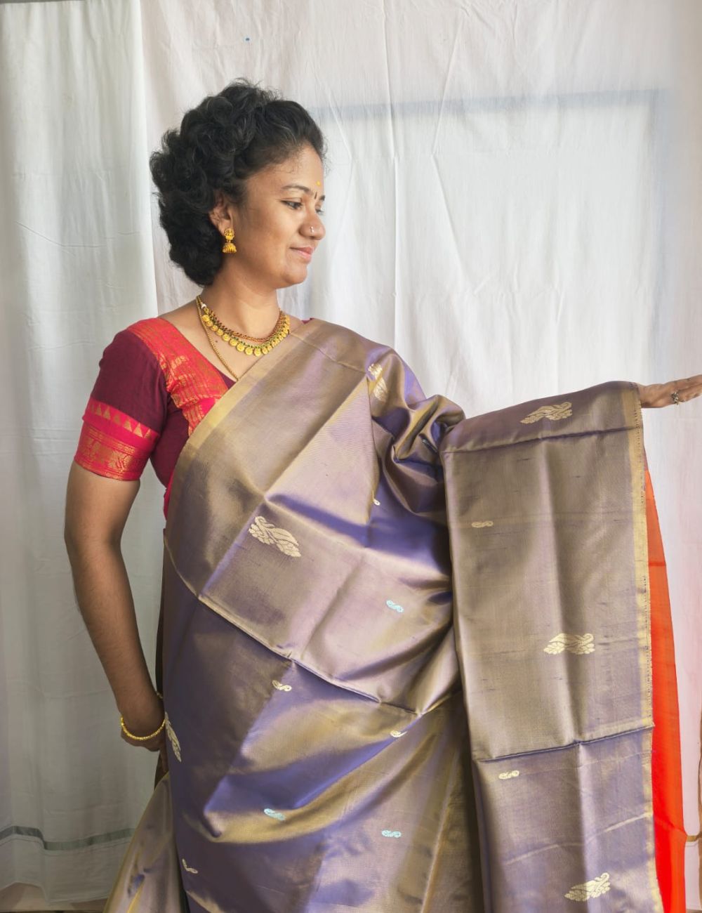 Vaazhai Naar Pattu Saree with Grey and bright orange combination with fancy traditional border and tussels