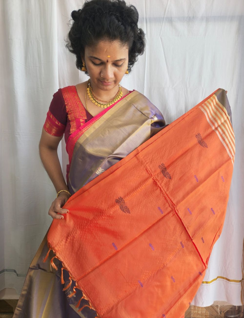 Vaazhai Naar Pattu Saree with Grey and bright orange combination with fancy traditional border and tussels